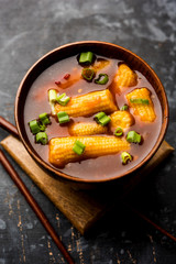 Baby Corn Manchurian with gravy - popular Indo-chinese recipe. selective focus