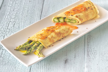 Coconut crepes with grilled asparagus