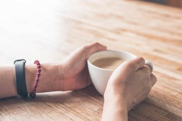 woman hold a cup a coffee