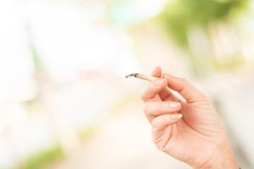 woman smoking and hold a cigarette