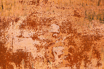 Bright red-orange iron sheet. Rust compound is an iron oxide. Texture of the metal sheet is prone to oxidation and corrosion. 