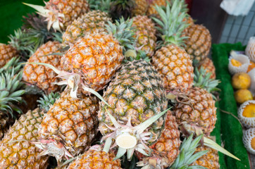 group of pineapple fruit at traditional marketplace