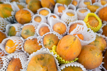 papaya fruit stacked on the marketplace