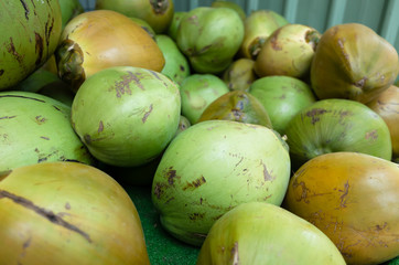 coconut fruit stacked on the marketplace