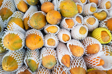 papaya fruit stacked on the marketplace