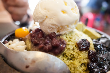 eating shaved ice with colorful dessert