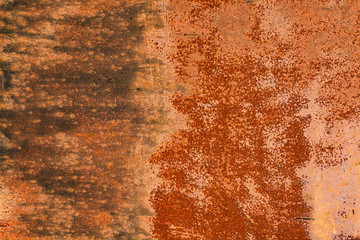 Bright red-orange iron sheet. Rust compound is an iron oxide. Texture of the metal sheet is prone to oxidation and corrosion. 