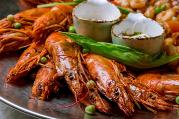 some langoustines on a plate on grey concrete
