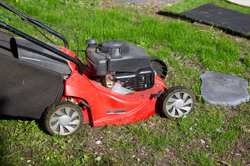 Red Lawn Mower Garden for Mowing the green grass