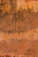 Rusty yellow-red textured metal surface. The texture of the metal sheet is prone to oxidation and corrosion. Textured background in grunge style