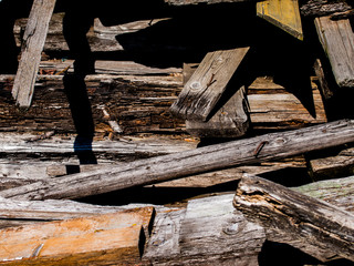 the old logs from the destroyed wooden house