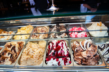 Ice cream in Rome, Italy. Italian gelateria. Ice-cream cafe, show window with sweeties.