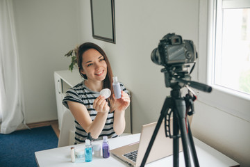 A beauty blogger or video blogger tells and shows subscribers how to do makeup.