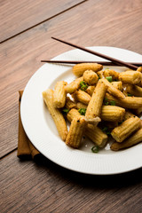 Baby Corn Manchurian dry - popular Indo-chinese starter recipe. selective focus