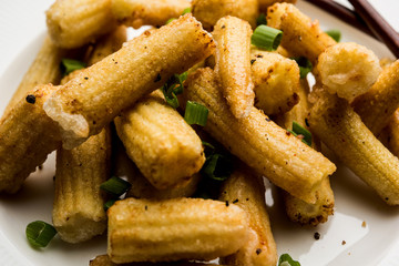 Baby Corn Manchurian dry - popular Indo-chinese starter recipe. selective focus