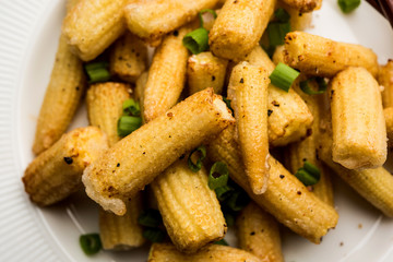 Baby Corn Manchurian dry - popular Indo-chinese starter recipe. selective focus