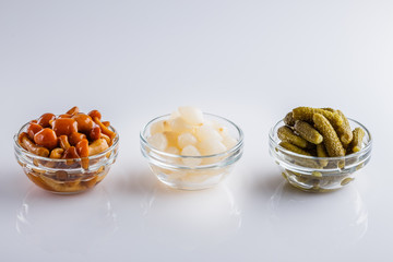 pickled vegetables on a white acrylic background