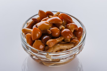 pickled vegetables on a white acrylic background