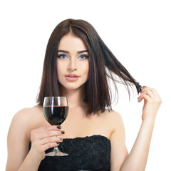 Young attractive woman holding glass of red wine. Pretty lady drinks alcoholic drink