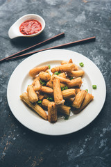 Baby Corn Manchurian dry - popular Indo-chinese starter recipe. selective focus