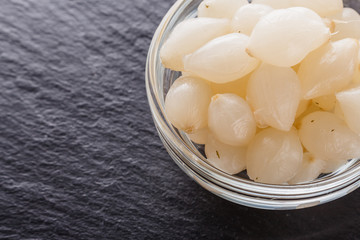 pickled vegetables on a dark stone background