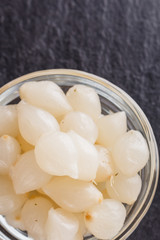 pickled vegetables on a dark stone background
