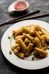 Baby Corn Manchurian dry - popular Indo-chinese starter recipe. selective focus