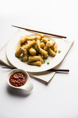 Baby Corn Manchurian dry - popular Indo-chinese starter recipe. selective focus