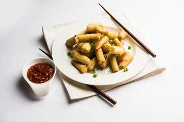Baby Corn Manchurian dry - popular Indo-chinese starter recipe. selective focus