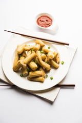 Baby Corn Manchurian dry - popular Indo-chinese starter recipe. selective focus