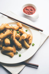 Baby Corn Manchurian dry - popular Indo-chinese starter recipe. selective focus