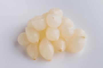 pickled vegetables on a white acrylic background