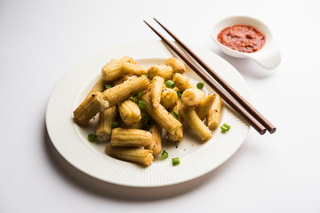 Baby Corn Manchurian dry - popular Indo-chinese starter recipe. selective focus