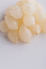 pickled vegetables on a white acrylic background