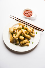 Baby Corn Manchurian dry - popular Indo-chinese starter recipe. selective focus