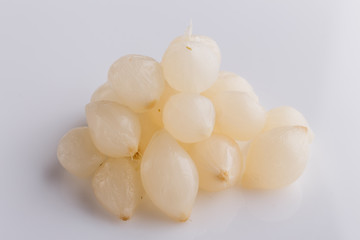 pickled vegetables on a white acrylic background