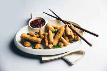 Baby Corn Manchurian dry - popular Indo-chinese starter recipe. selective focus
