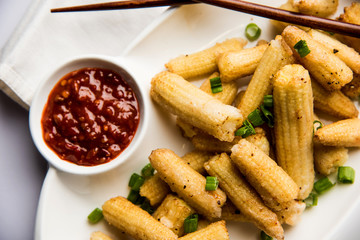 Baby Corn Manchurian dry - popular Indo-chinese starter recipe. selective focus