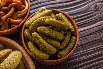 pickled vegetables on a wooden rustic background