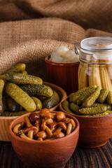 pickled vegetables on a wooden rustic background