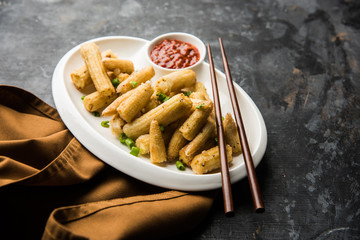 Baby Corn Manchurian dry - popular Indo-chinese starter recipe. selective focus