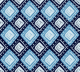 Ethnic vector seamless pattern with hand drawn geometric rhombus shapes in blue colors for fashion and textile designs