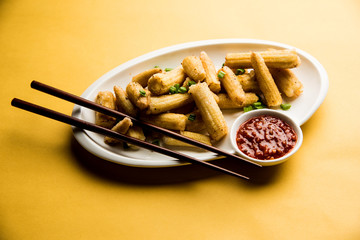 Baby Corn Manchurian dry - popular Indo-chinese starter recipe. selective focus