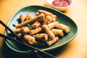 Baby Corn Manchurian dry - popular Indo-chinese starter recipe. selective focus