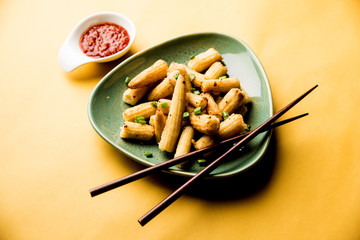 Baby Corn Manchurian dry - popular Indo-chinese starter recipe. selective focus