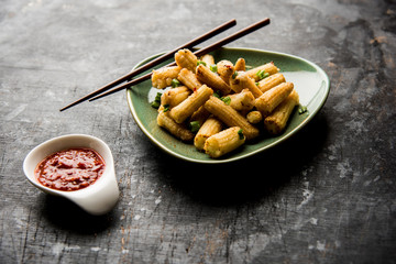 Baby Corn Manchurian dry - popular Indo-chinese starter recipe. selective focus