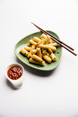 Baby Corn Manchurian dry - popular Indo-chinese starter recipe. selective focus