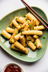 Baby Corn Manchurian dry - popular Indo-chinese starter recipe. selective focus