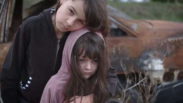 Portrait of homeless children. Sad little girls in the slums. Children without home concept. Childhood without war. Children of the Sirat.