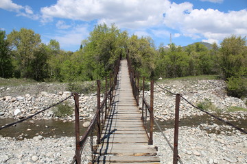 Fototapeta na wymiar wooden suspension bridge